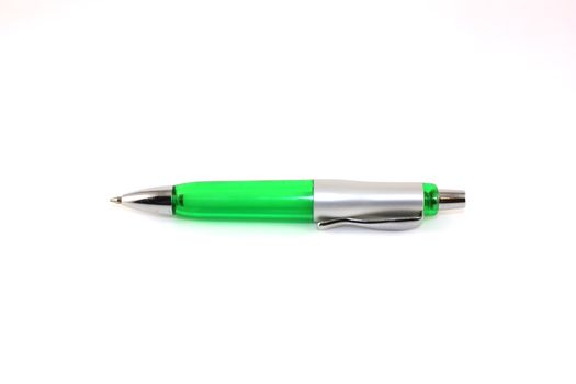 Green ball-point pen over white