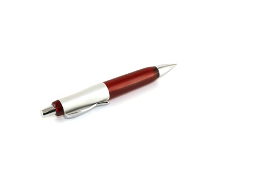 Brown ball-point pen over white