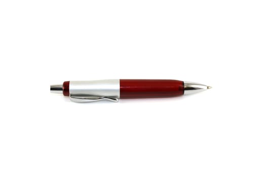 Brown ball-point pen over white