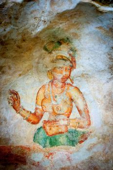 Ancient famous paintings (frescoes) on stone wall at Sigirya Sri Lanka