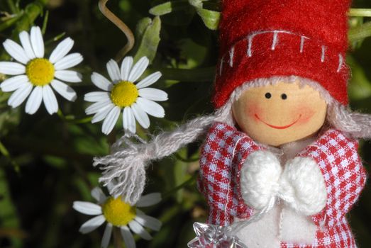 christmas card, cheerful santa claus elf girl with daisies