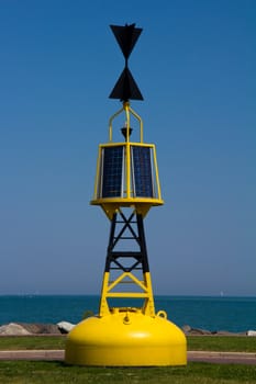 A bright yellow solar powered marker bouy