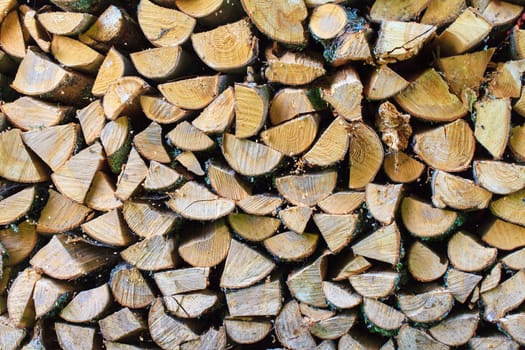 Background of Stacked Chopped Firewood Logs, closeup