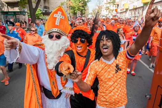 KHARKIV, UKRAINE - JUNE 08: Football fans during footbal match at fan-zone during football match Netherlands vs Denmark, June 08, 2012 in Kharkov, Ukraine