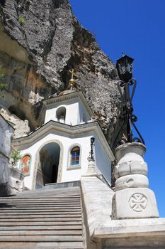 Nice white Christianity church with staircase in the rock