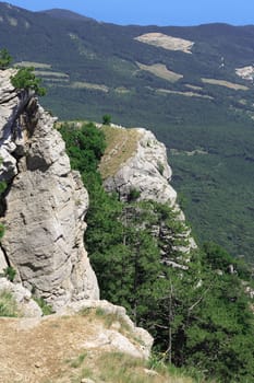 Beautiful summer landscape with high rocks and trees