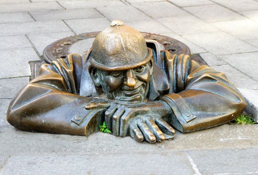 Bronze sculpture Man at work alias Cumil, Bratislava, Slovakia