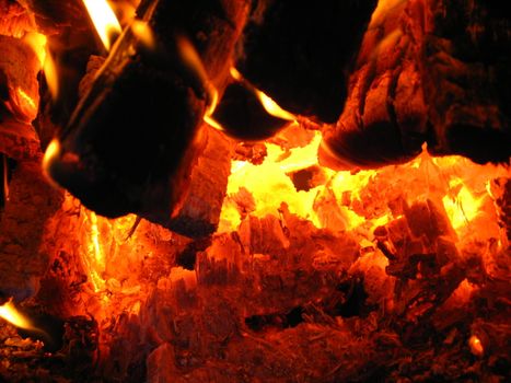 Fire wood brighly burning in the furnace