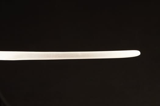 Blade of salmon and ham slicer knife - on black background