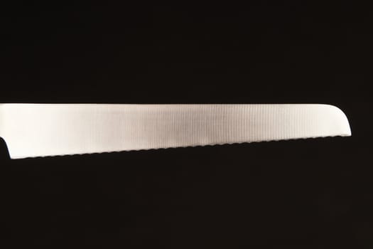 Blade of bread knife - on black background