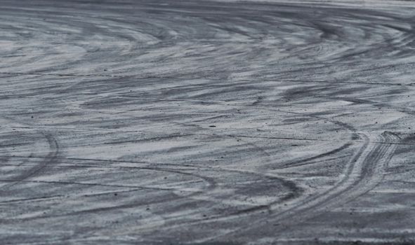 Background with tire marks on road track