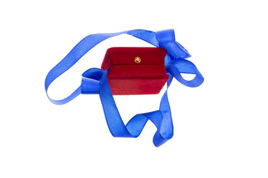 Red velvet gift box and blue ribbon on a white background