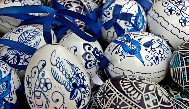 Blue and white easter eggs with ribbon - traditional background - shallow DOF