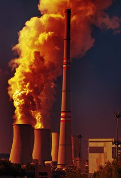 Power plant with dramatic clouds of smoke pollution