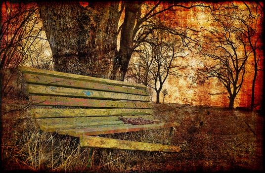 Fall is a sad season - old broken bench with cracked paint in grunge style