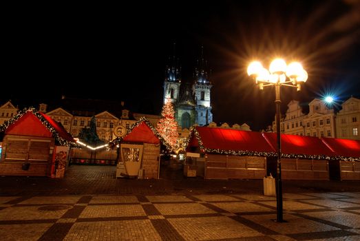 Old Town Square in Prague during Christmas markets. Lamp in the front