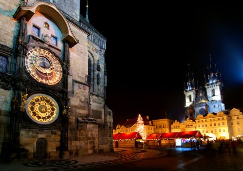 Old Town Square in Prague with Tyn Cathedral and Astronomical Clock during the Christmas celebrations at night