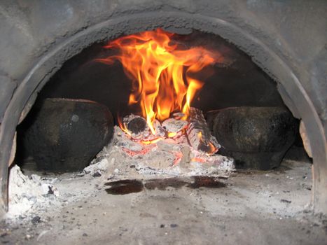 The image of cooking on fire in the furnace