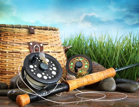 Closeup of fly fishing equipment and basket 