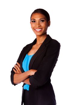 Beautiful happy smiling African executive business woman in suit and arms crossed, isolated.