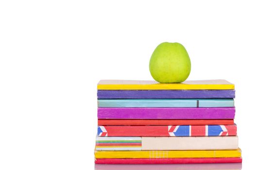 Apple and books on a white background
