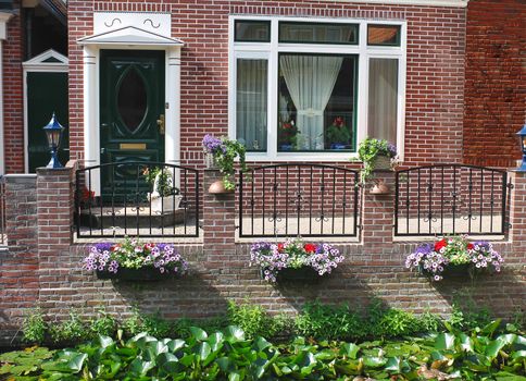 Flowers in front of the Dutch house. Netherlands