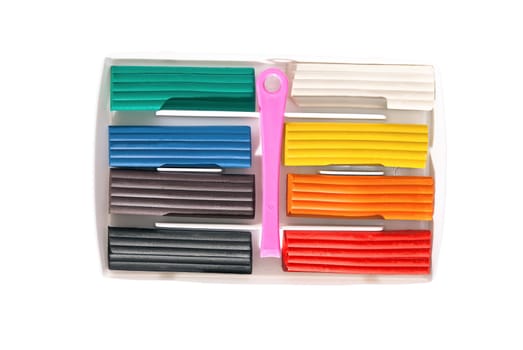 Packing a colorful children's modeling clay on a white background.