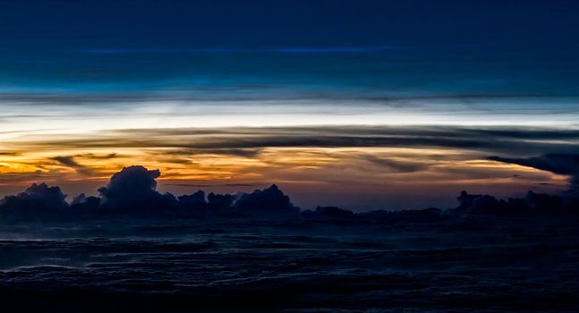 Beautiful clouds forming a mystical and dreamy cloudscape 30000 feet in the air