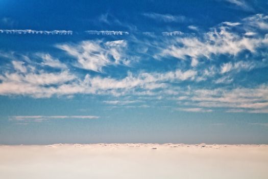 Beautiful clouds forming a mystical and dreamy cloudscape 30000 feet in the air