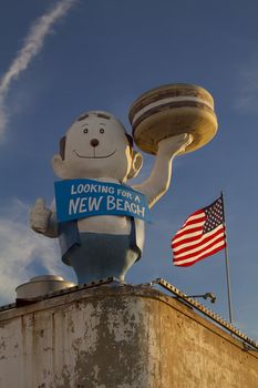 Burger boy on top of roof at Coney Island