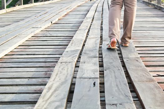 Girl is walking on the bridge