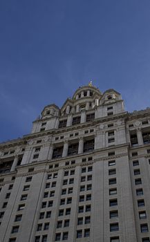 Closeup view of New York city town hall against a blue sky