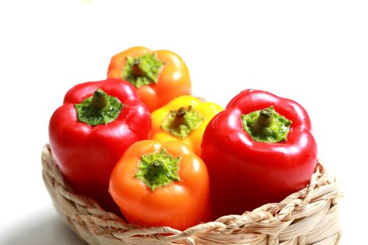 colorful mini paprika in a woven basket