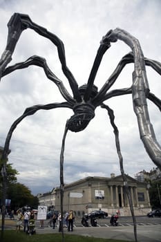 Maman (1999) is a sculpture by the artist Louise Bourgeois. The sculpture, which resembles a spider, is over 30ft high and over 33ft wide, with a sac containing 26 marble eggs.  The sculpture alludes to the strength of her mother, with metaphors of spinning, weaving, nurture and protection.