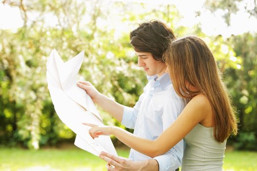 a young married couple examines the design of its new home