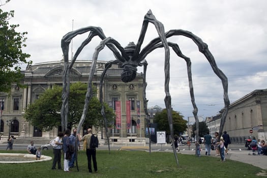 Maman (1999) is a sculpture by the artist Louise Bourgeois. The sculpture, which resembles a spider, is over 30ft high and over 33ft wide, with a sac containing 26 marble eggs.  The sculpture alludes to the strength of her mother, with metaphors of spinning, weaving, nurture and protection.