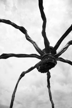 Maman (1999) is a sculpture by the artist Louise Bourgeois. The sculpture, which resembles a spider, is over 30ft high and over 33ft wide, with a sac containing 26 marble eggs.  The sculpture alludes to the strength of her mother, with metaphors of spinning, weaving, nurture and protection.