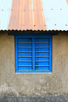 Old color wooden window on cement wall