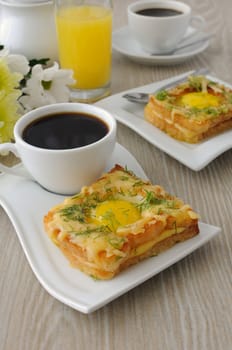 Toast with egg and cheese with dill and a cup of coffee