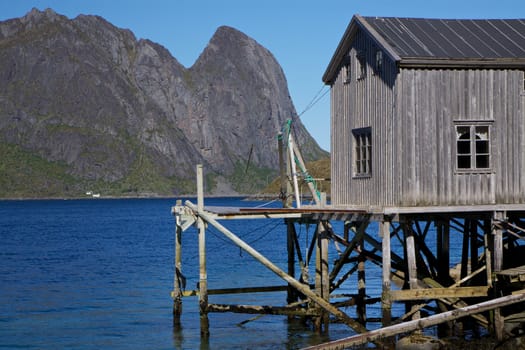 Old detoriated fishing port by the fjord on Lofoten islands in Norway