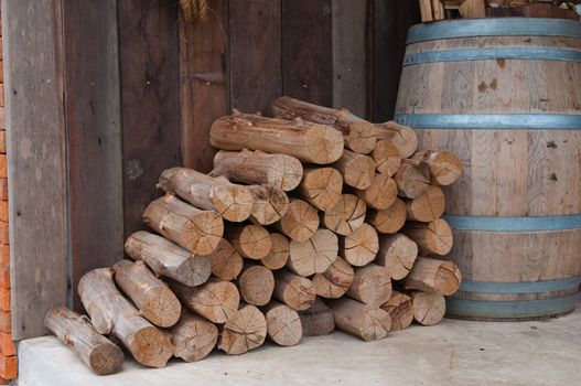 dry chopped firewood logs stacked up on top of each other in a pile