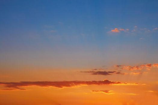 Multicolor clouds at sunset, fine summer evening