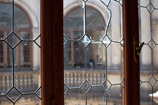 View into an office through ead glass windows of an old building