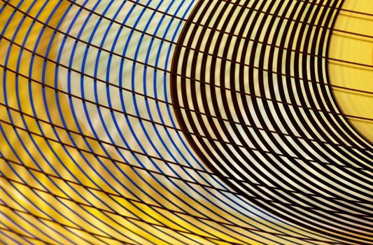 Glassware curves of black, and blue on yellow and white background