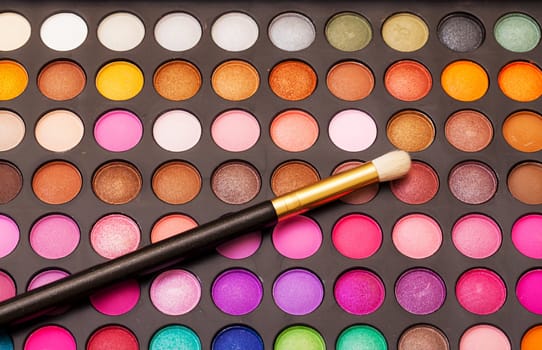 Set of Multicolored Eyeshadows with Brush, closeup