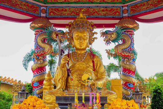 Statue of Guan Yin. The golden shrine.