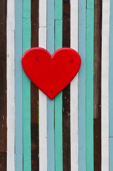 red heart on colorful of old wood background 