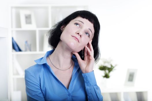 Portrait of a business woman in the office doing some paperwork