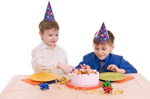 two boys eating a cake isolated on white background