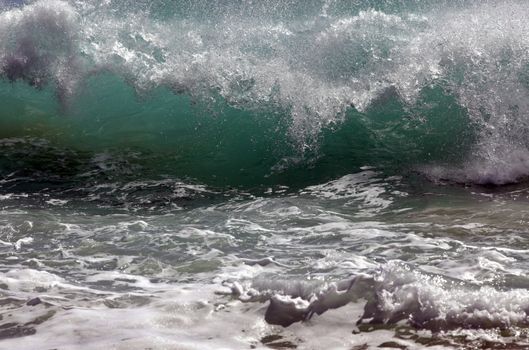 Big wave crashes on to the shore. Indian ocean